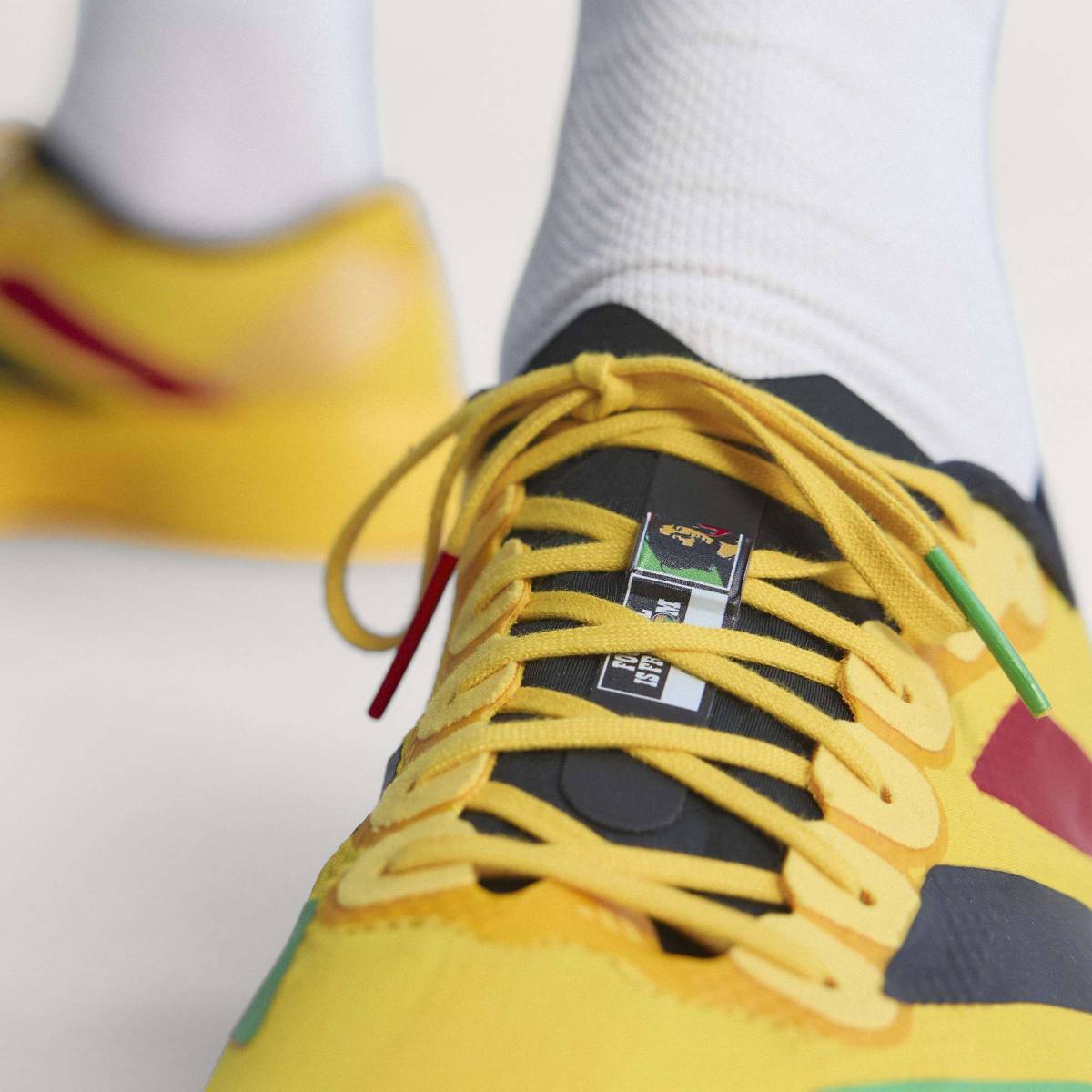 + Bob Marley Adizero Evo SL ‘Bold Gold’