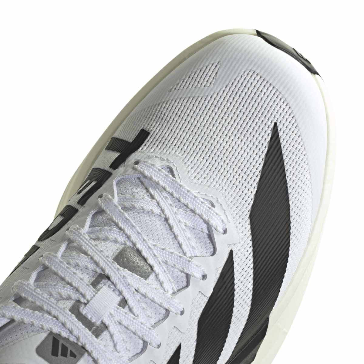 White athletic shoe with black accents on a white background