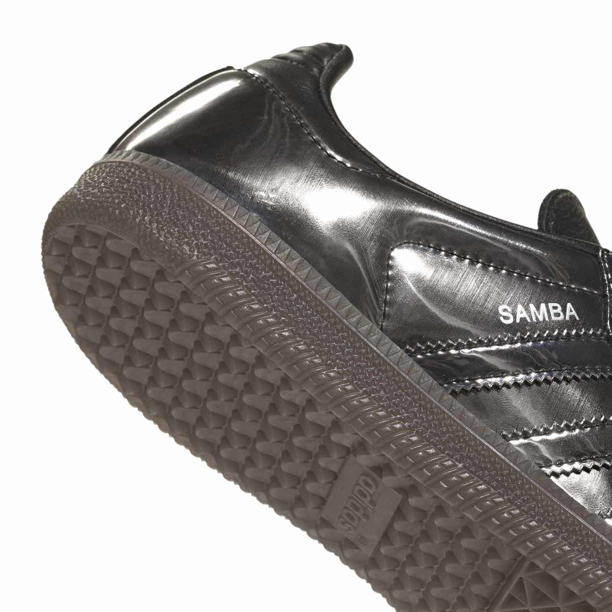 Silver Adidas Samba sneaker with textured sole on a white background