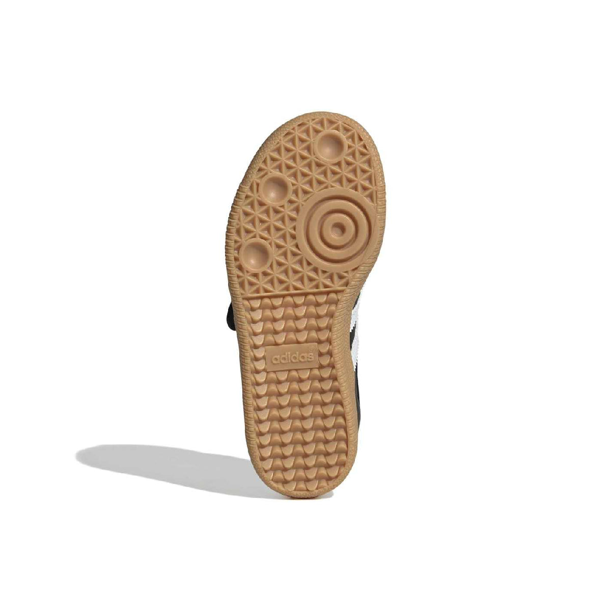 The textured brown rubber outsole of a shoe, shown vertically against a plain white background with a soft shadow.