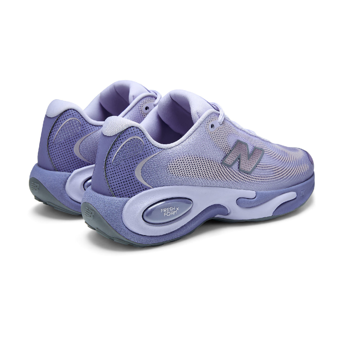 A New Balance sneaker in purple, and white, shown from a side profile view against a plain white background