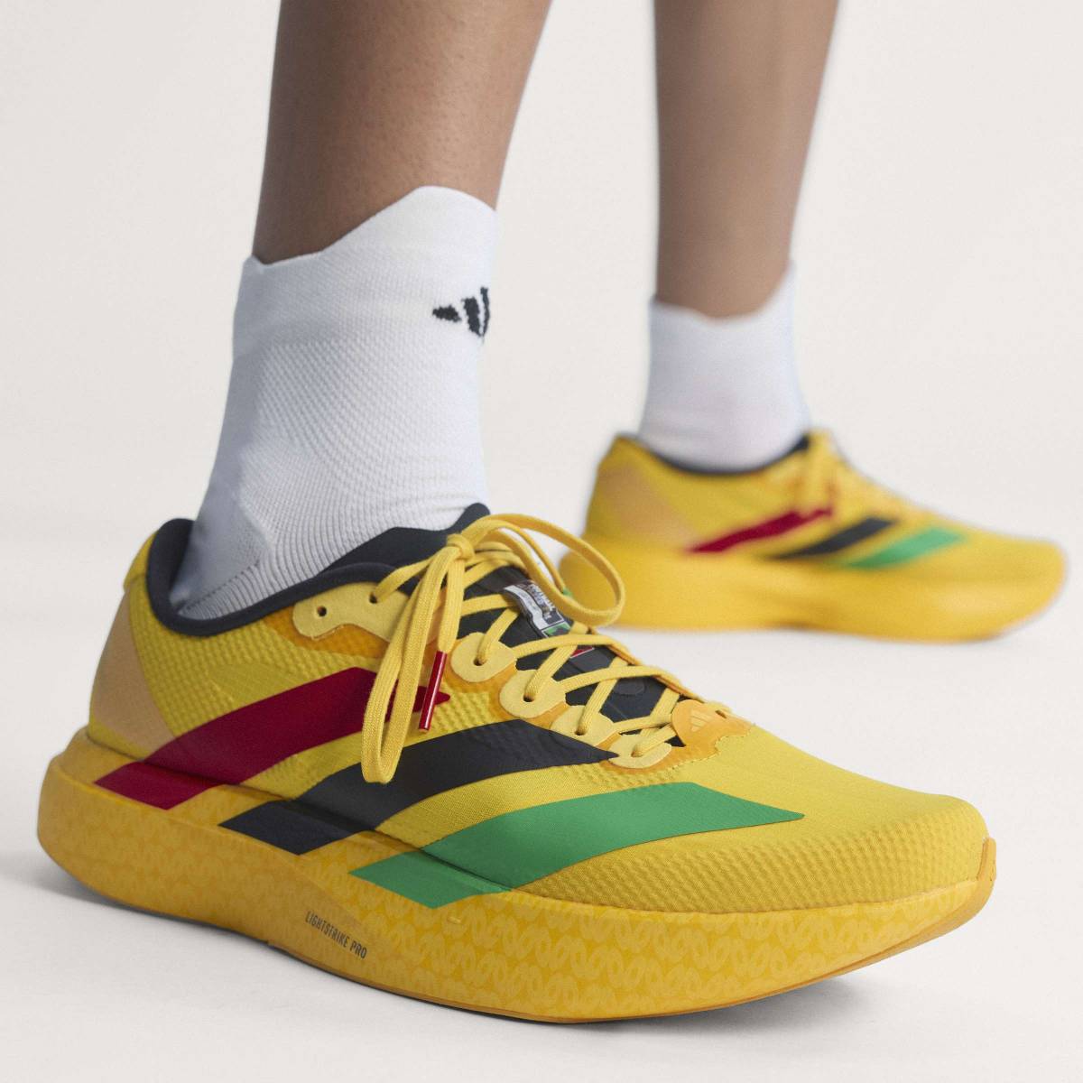 + Bob Marley Adizero Evo SL ‘Bold Gold’