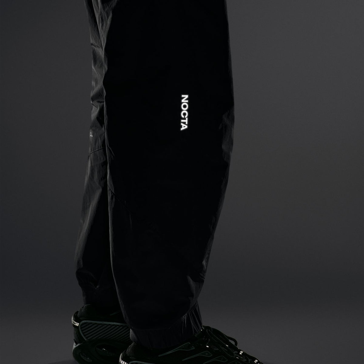 + NOCTA Zombie Cut Track Pants 'Black'
