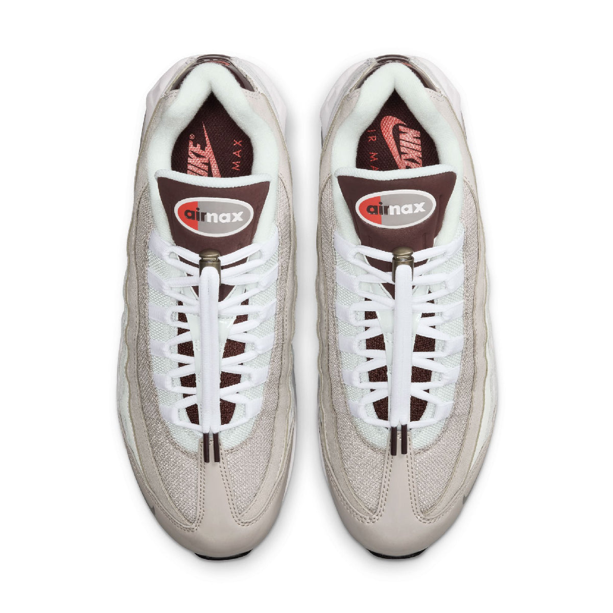 A pair of Nike Air Max 95 sneakers in a light beige and white colorway, shown from a top-down view on a white background.