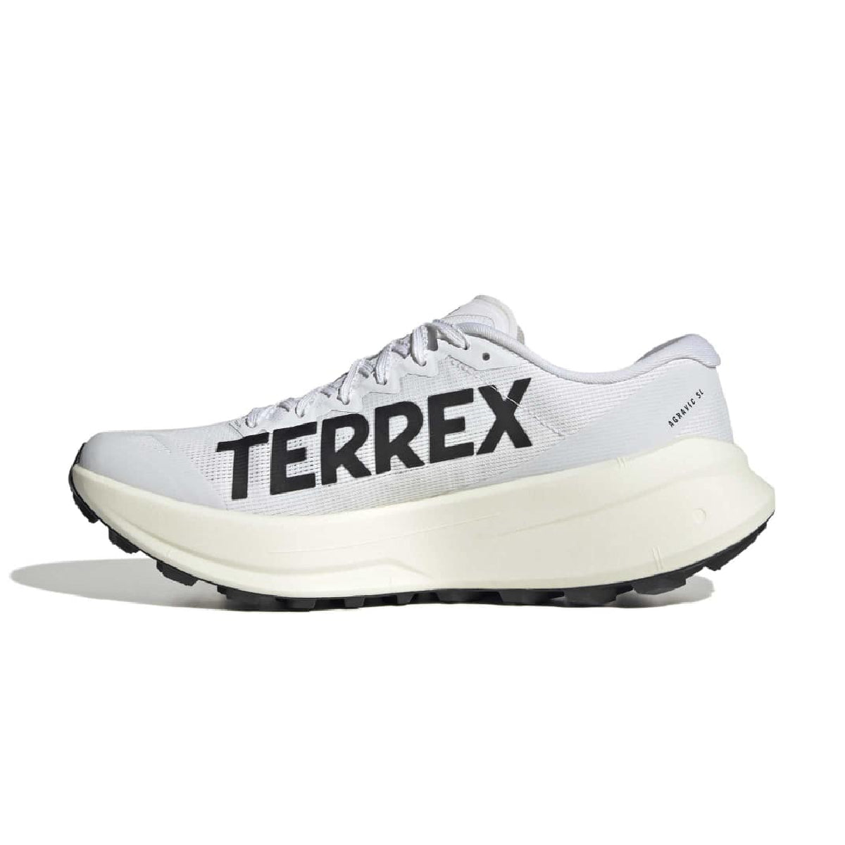A white and light gray running shoe with a thick cream-colored midsole and bold black 'TERREX' branding on the side, shown against a plain white background.
