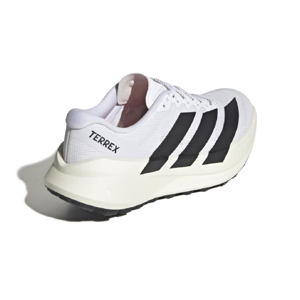 A white Adidas running shoe with black three-stripes and 'TERREX' branding, shown from a side-rear angle on a white background with a soft shadow.