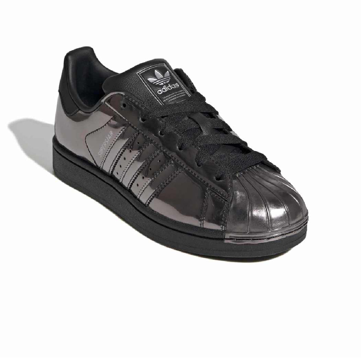 A black Adidas Samba sneaker with glossy patent leather panels, black laces, and a dark gray sole, shown on a white background with a soft shadow.