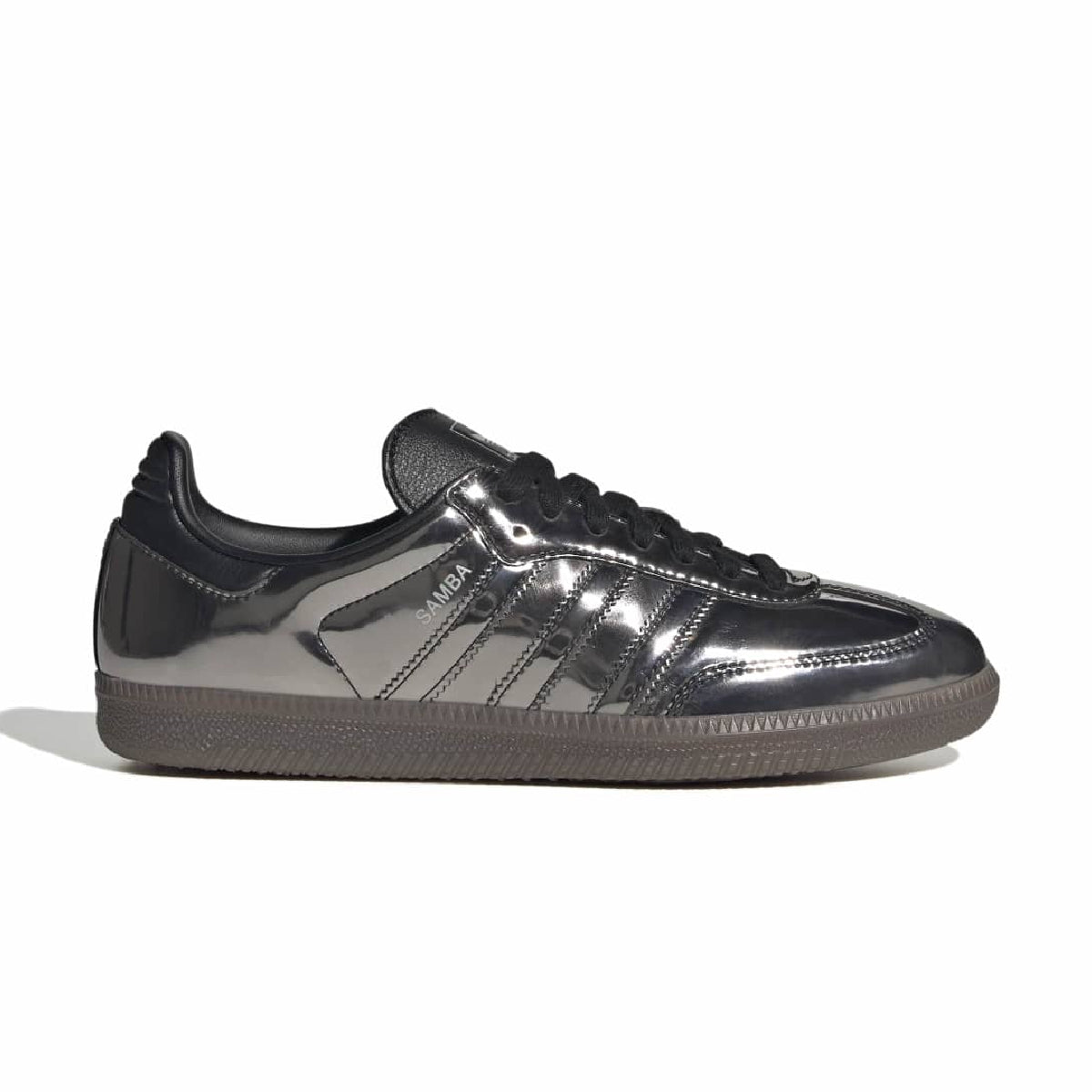 A single Adidas Samba sneaker in metallic dark gray with black laces and a dark brown gum sole, shown in a side profile on a white background.