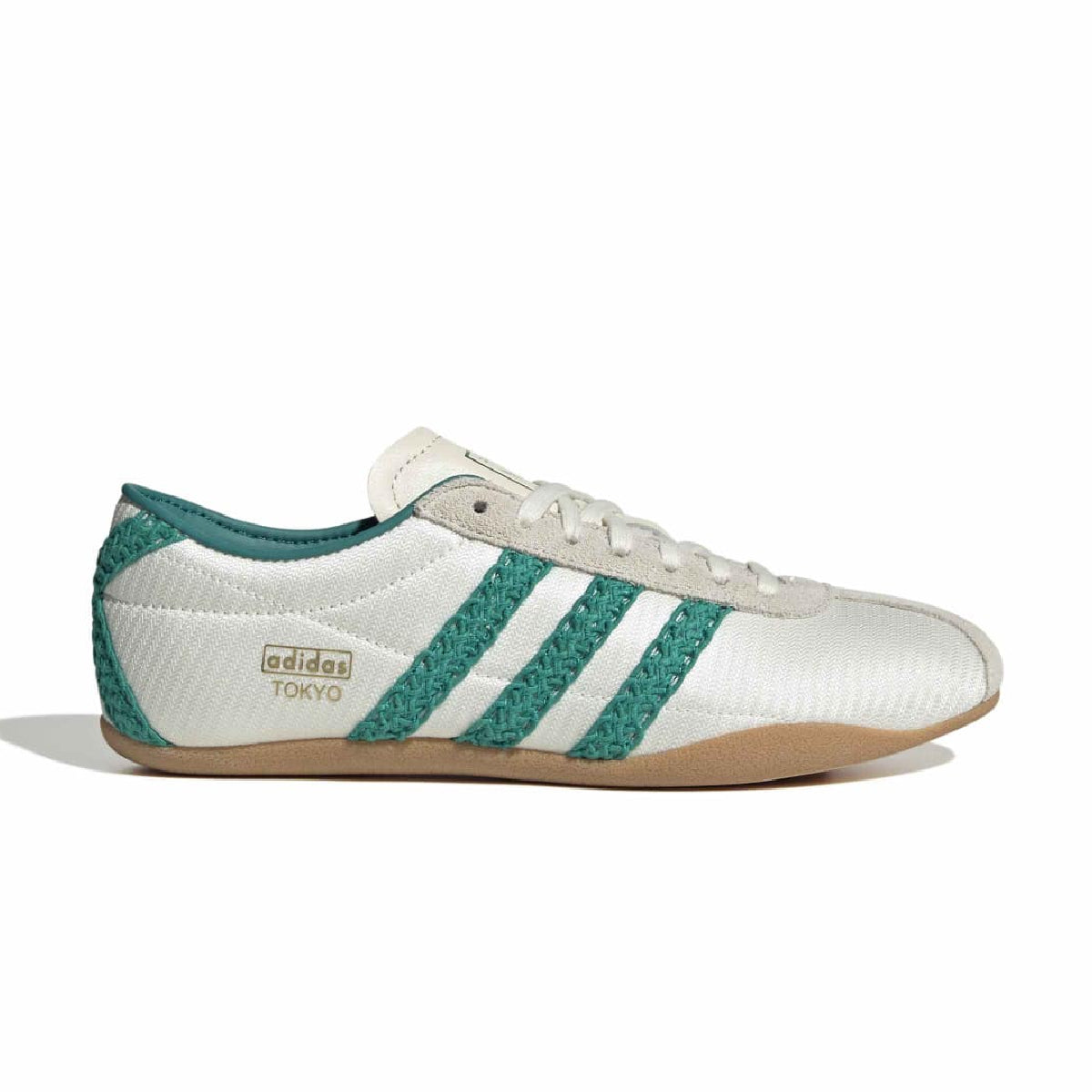 An Adidas Tokyo low-top sneaker in white and teal green, featuring textured knit panels, white laces, and a gum sole, shown in a side profile on a white background.
